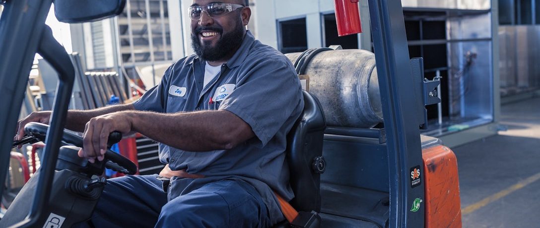 african american forklift operator at work in a warehouse